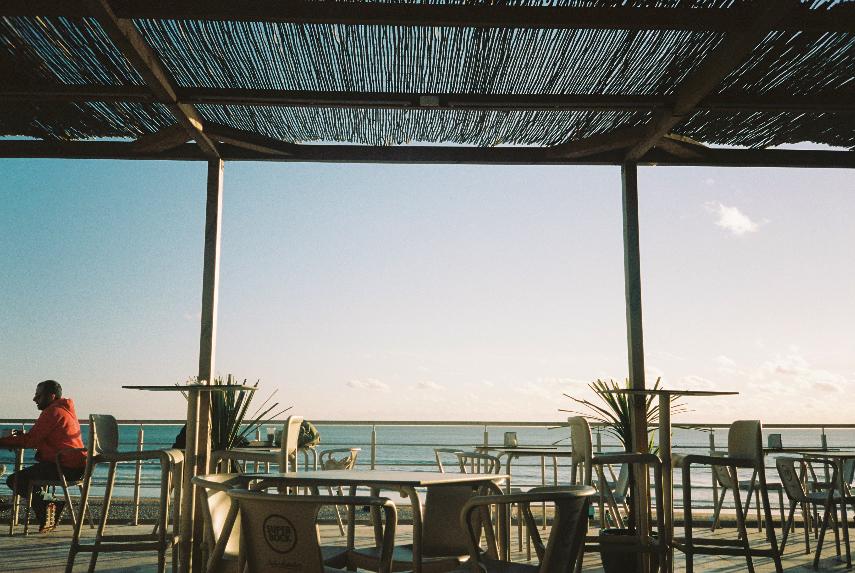 A beachside café terrace in Carcavelos, Portugal — where Bonjournal founder Tom Keysers started his language journaling habit